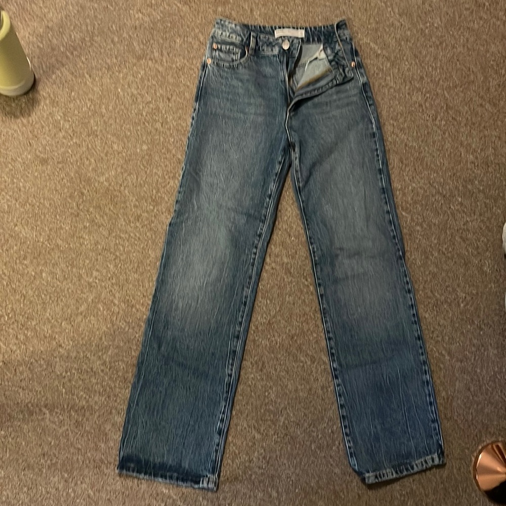 Size 03 or 26 high rise garage blue jeans.